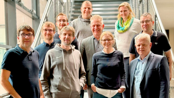 Gruppenfoto kooperierende Mitarbeiter